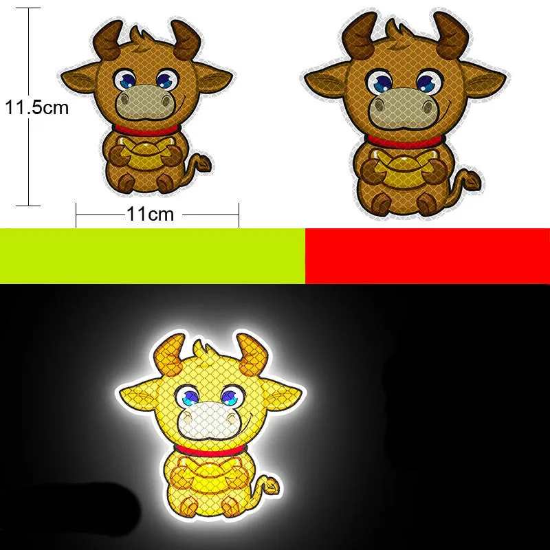A pair of diamond-grade reflective safety stickers for vehicles, showing sample designs like a smiling cat or tiger.