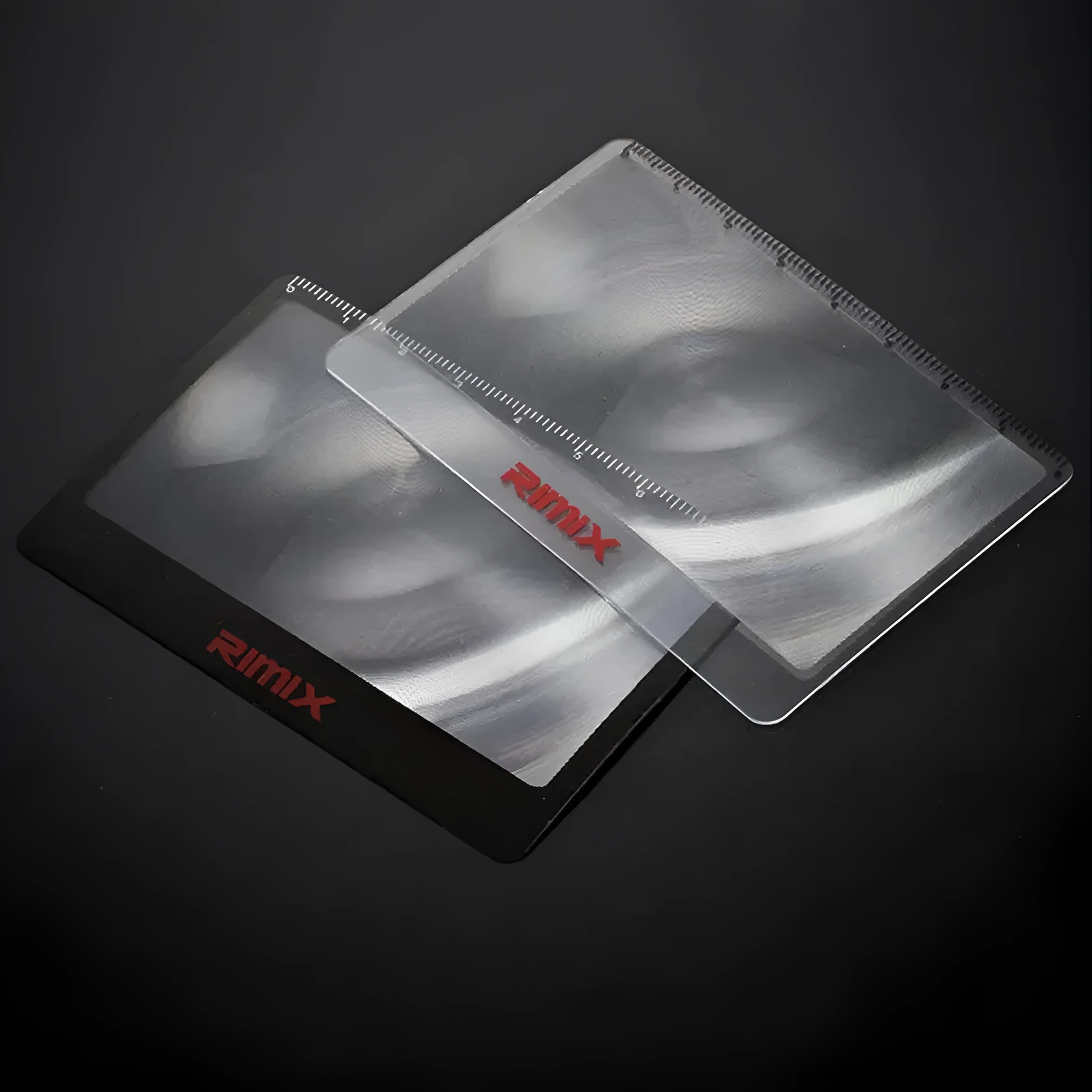 Credit card sized plastic magnifier in black or white colour for portable reading assistance