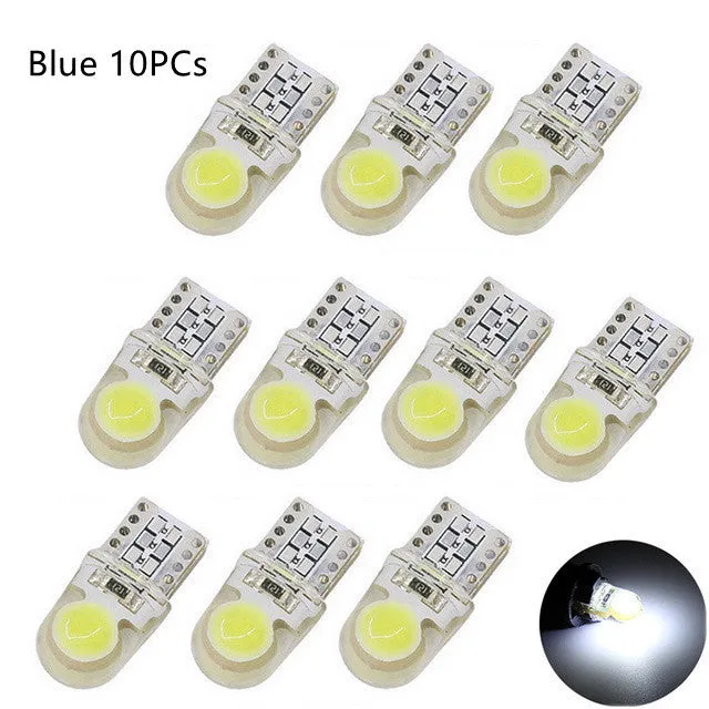 Ten T10 LED bulbs for cars in various colours including blue, red, and white, showing their 21.5mm length.