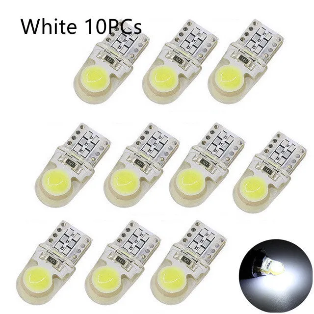 Ten T10 LED bulbs for cars in various colours including blue, red, and white, showing their 21.5mm length.