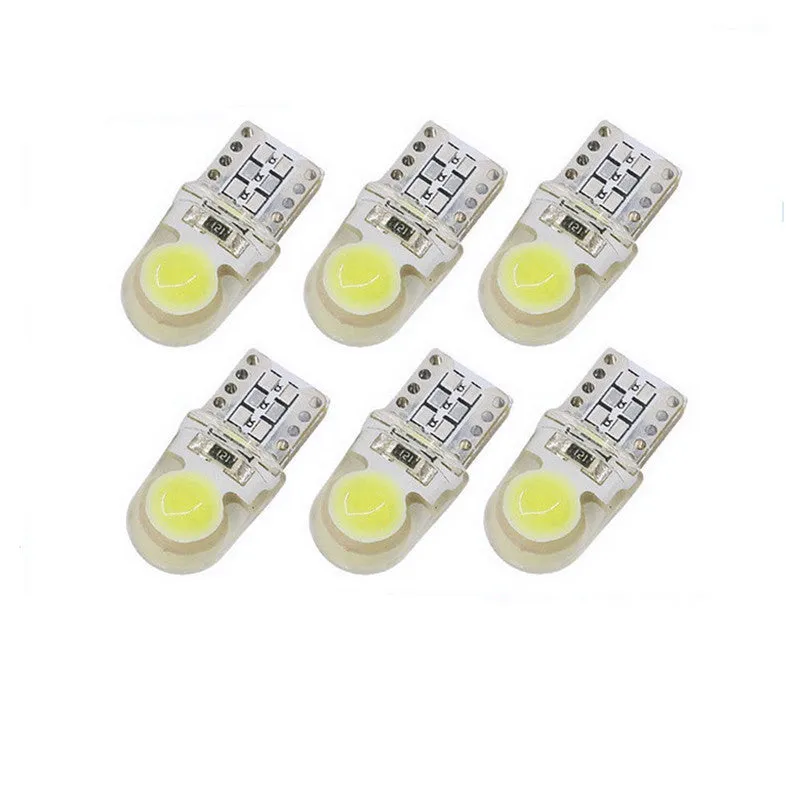 Ten T10 LED bulbs for cars in various colours including blue, red, and white, showing their 21.5mm length.