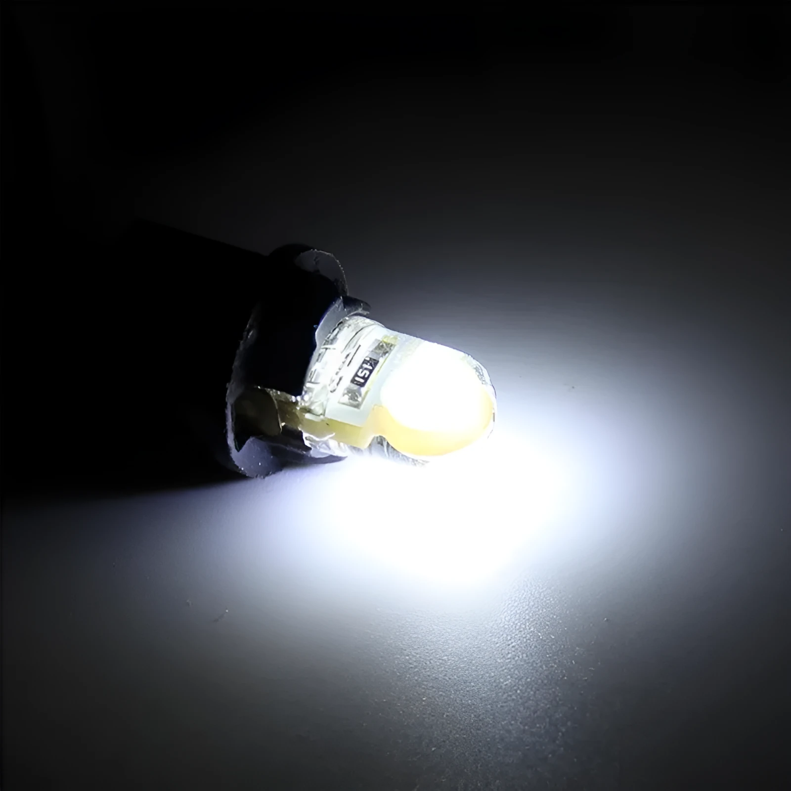 Ten T10 LED bulbs for cars in various colours including blue, red, and white, showing their 21.5mm length.