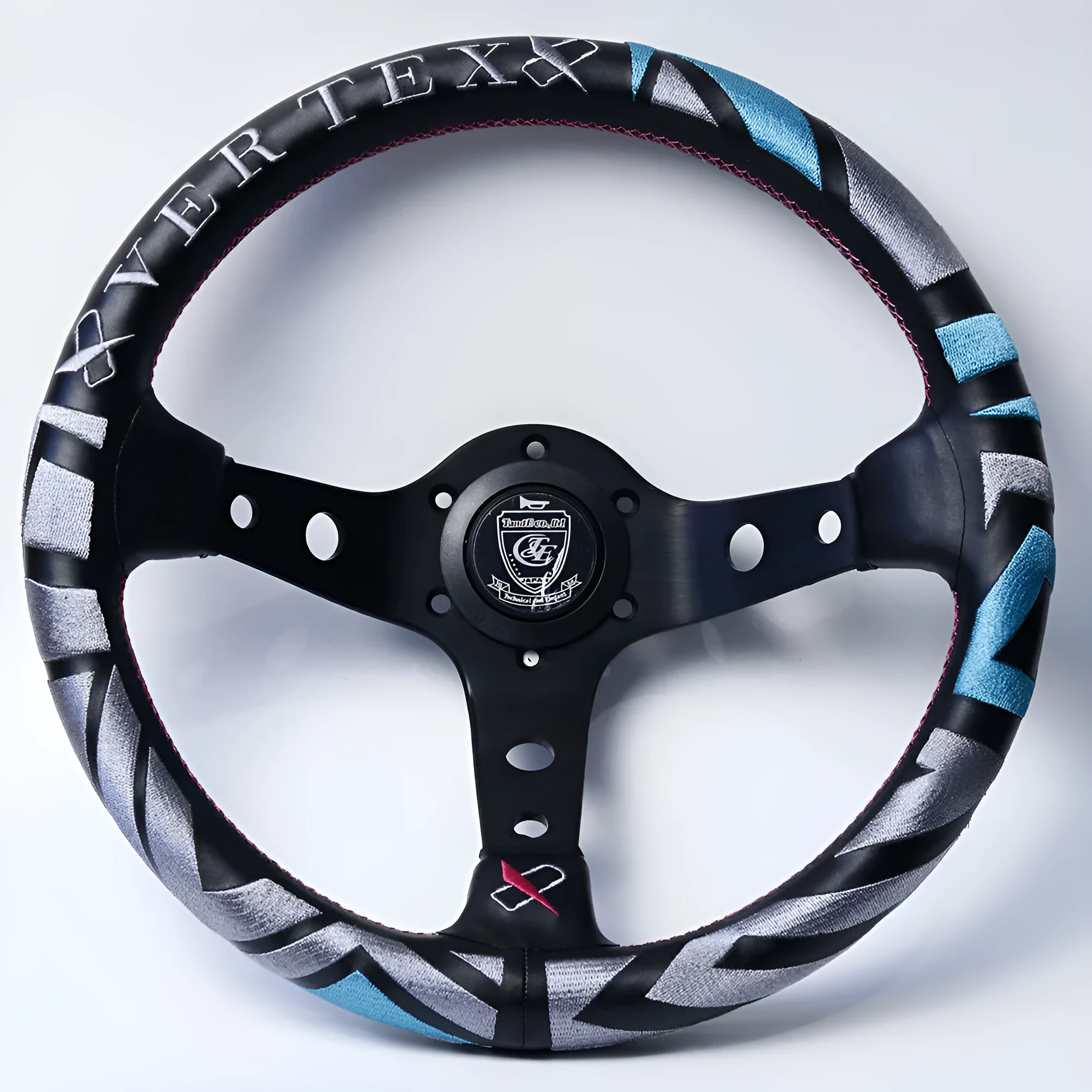 Black alloy racing steering wheel with deep concave rim and star embroidery pattern.