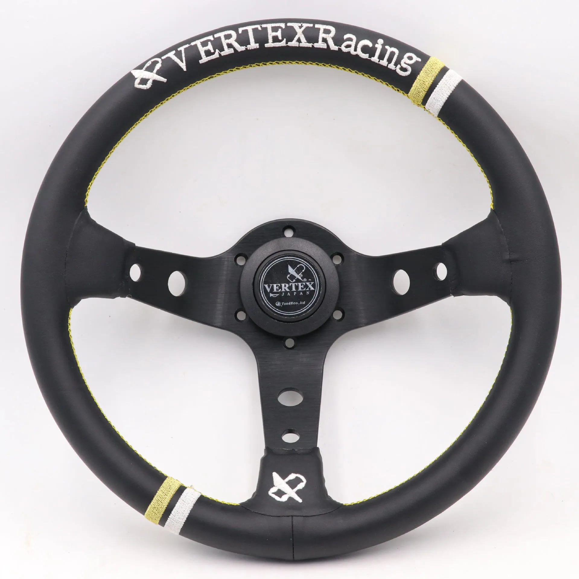 Black alloy racing steering wheel with deep concave rim and star embroidery pattern.