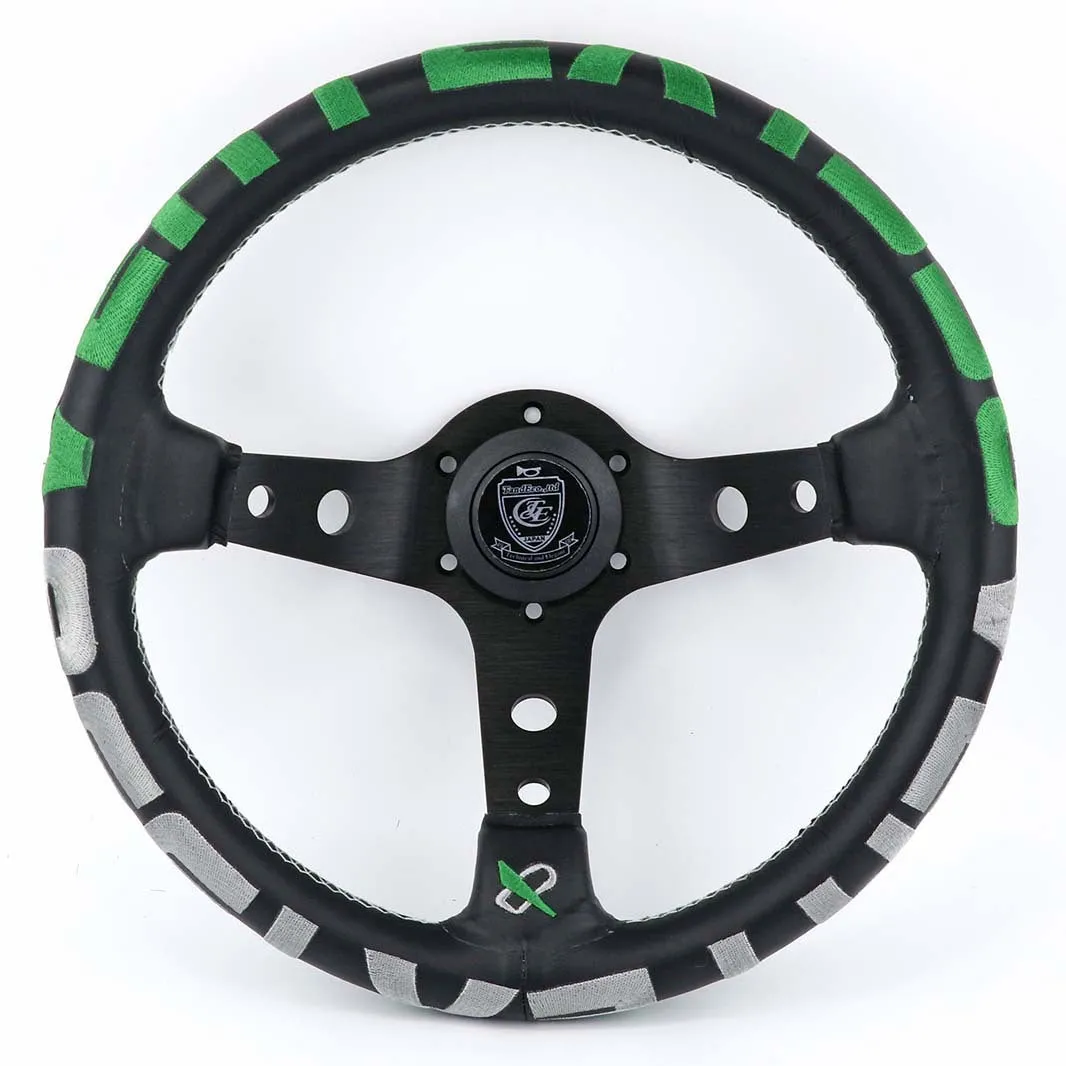 Black alloy racing steering wheel with deep concave rim and star embroidery pattern.