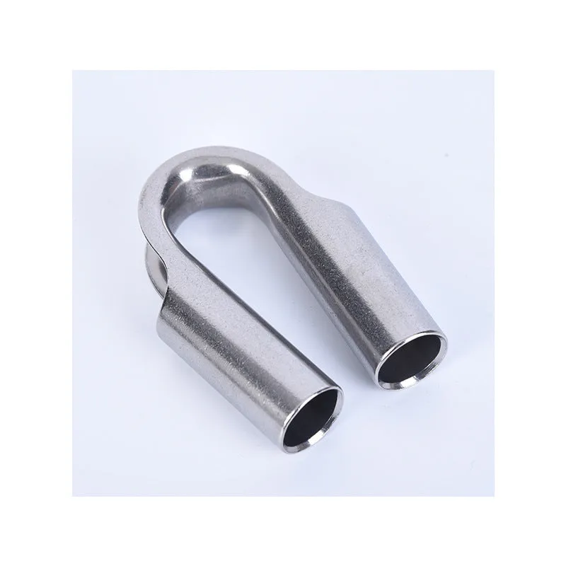 Set of stainless steel tubular chicken heart sleeve rings in various sizes on a workbench.