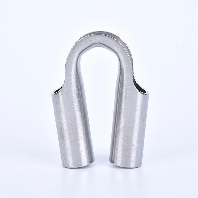 Set of stainless steel tubular chicken heart sleeve rings in various sizes on a workbench.