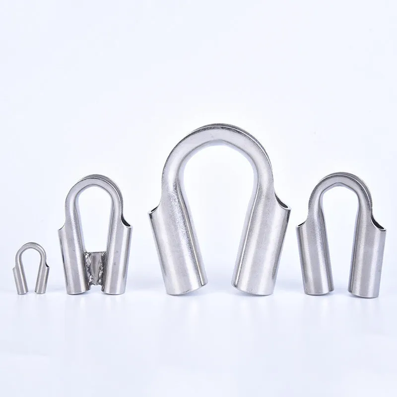 Set of stainless steel tubular chicken heart sleeve rings in various sizes on a workbench.