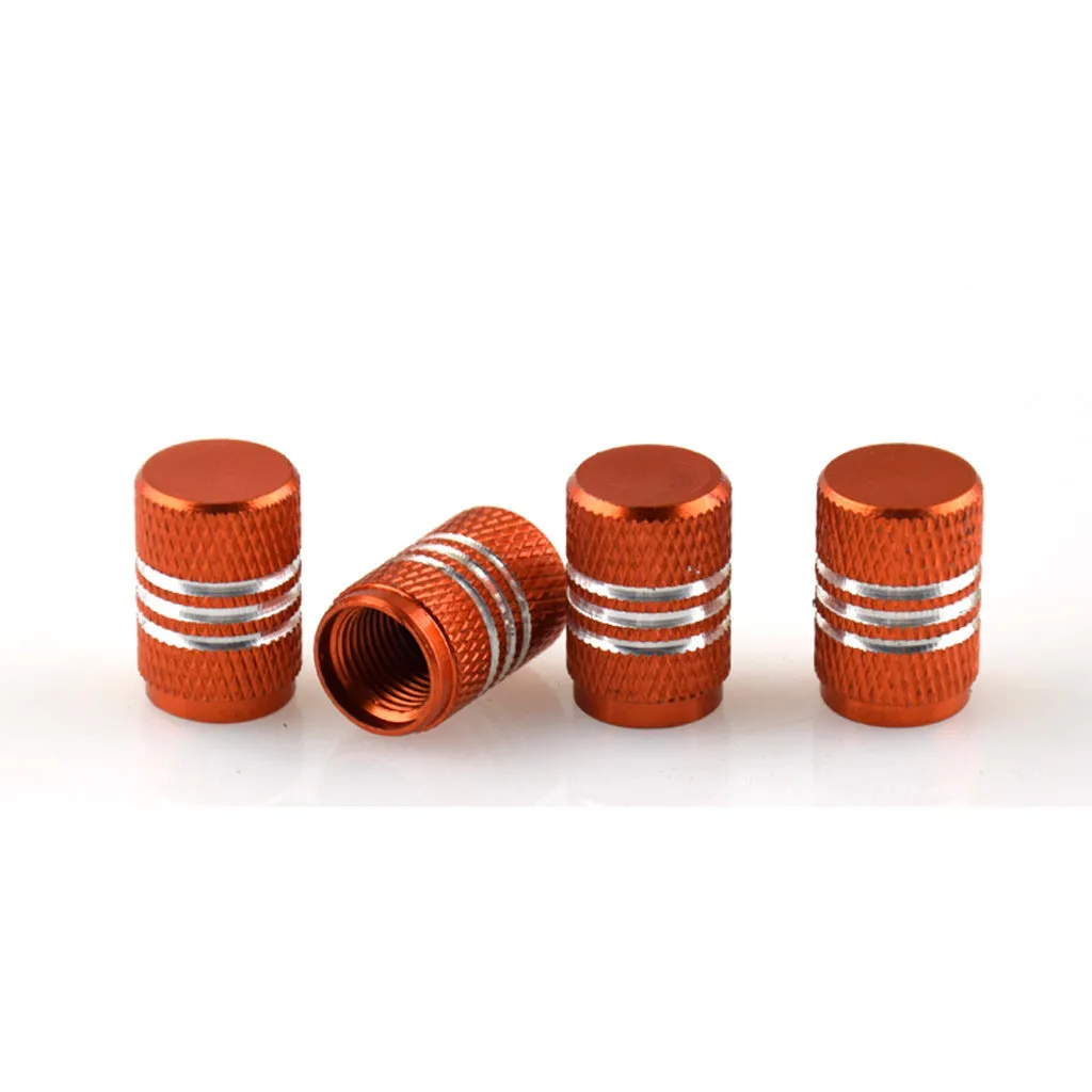 Set of aluminium alloy car tyre valve caps in multiple colours including red, blue, silver, and black.