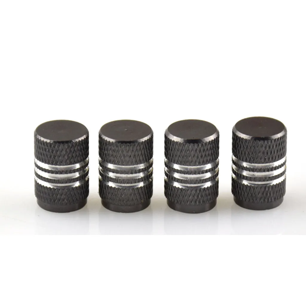 Set of aluminium alloy car tyre valve caps in multiple colours including red, blue, silver, and black.