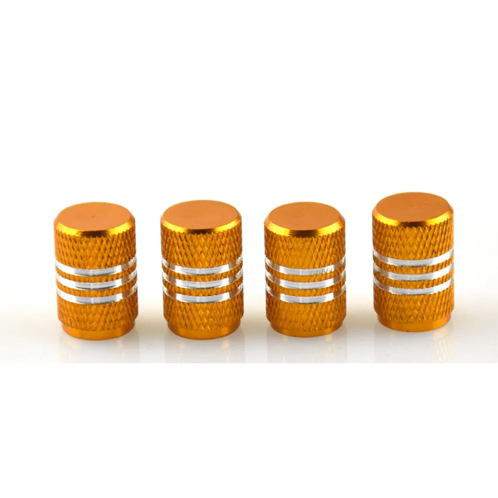 Set of aluminium alloy car tyre valve caps in multiple colours including red, blue, silver, and black.