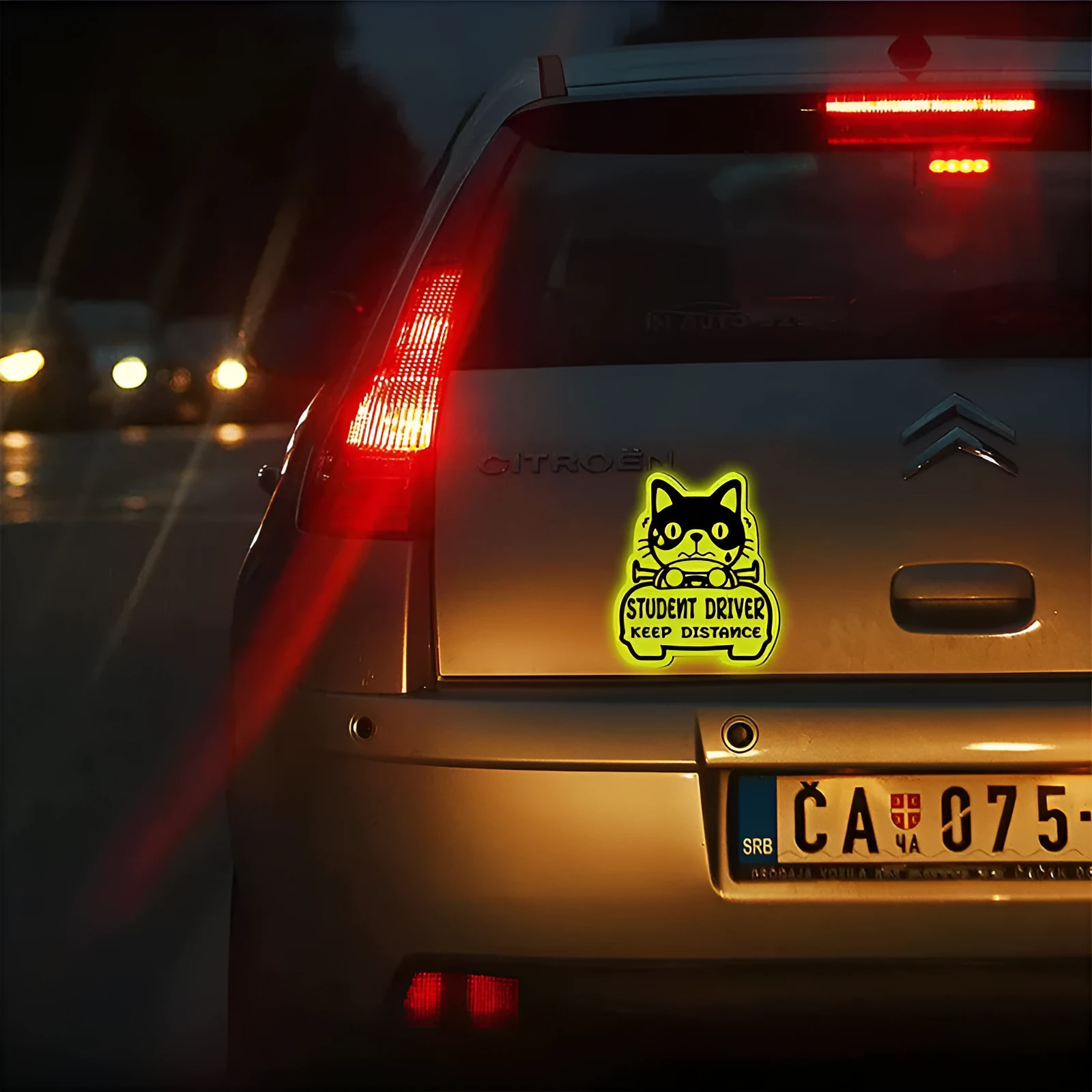 Set of three magnetic reflective safety stickers in animal shapes including cats and ducks for bike helmets and backpacks.