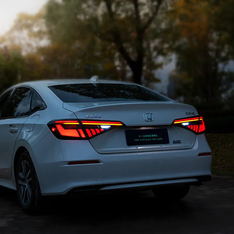 11th Generation Honda Civic modified LED taillight assembly with sequential streamer turn signals in black and red finish.
