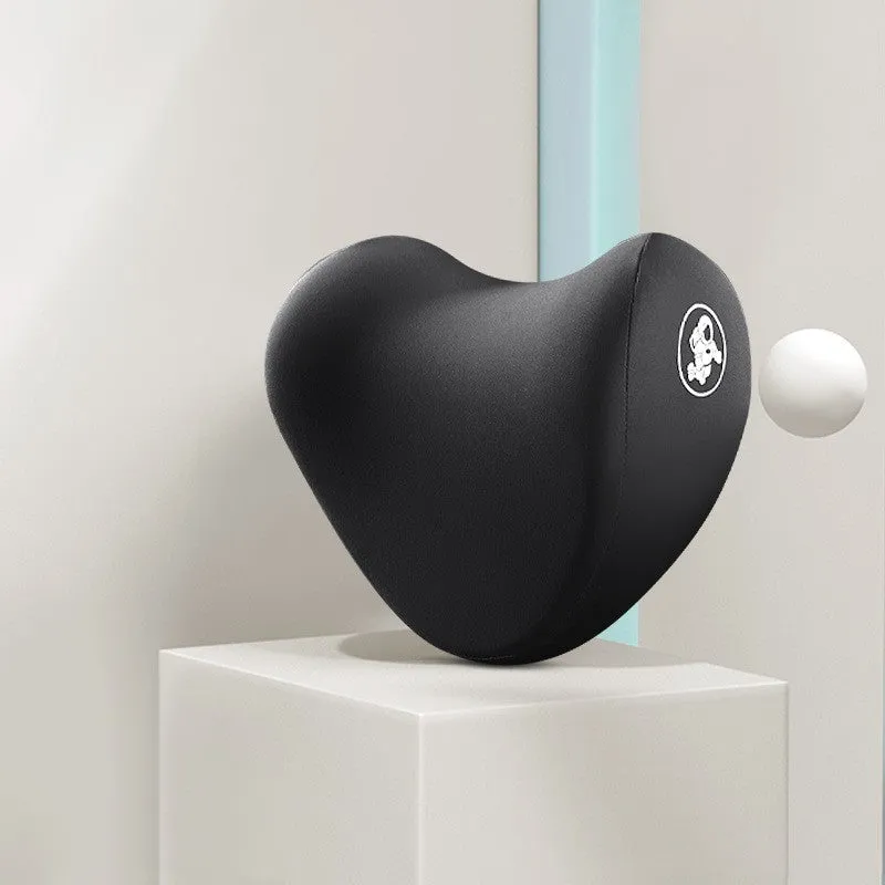 Heart-shaped car pillow in choice of colours, shown as headrest and lumbar support on a car seat.