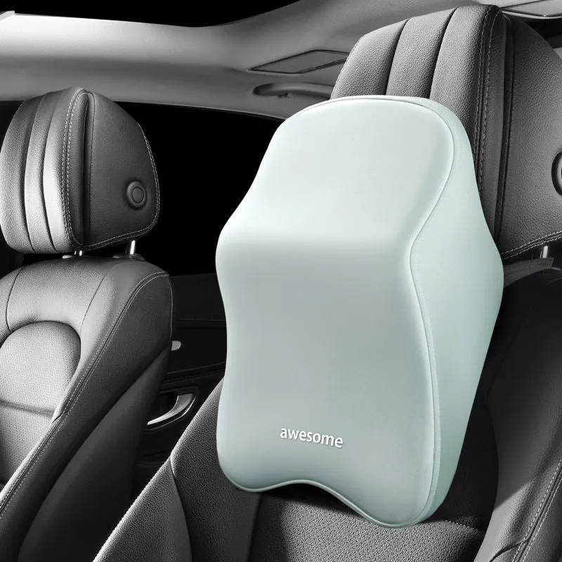 Black geometric pattern memory foam car lumbar pillow and matching headrest on a car seat.
