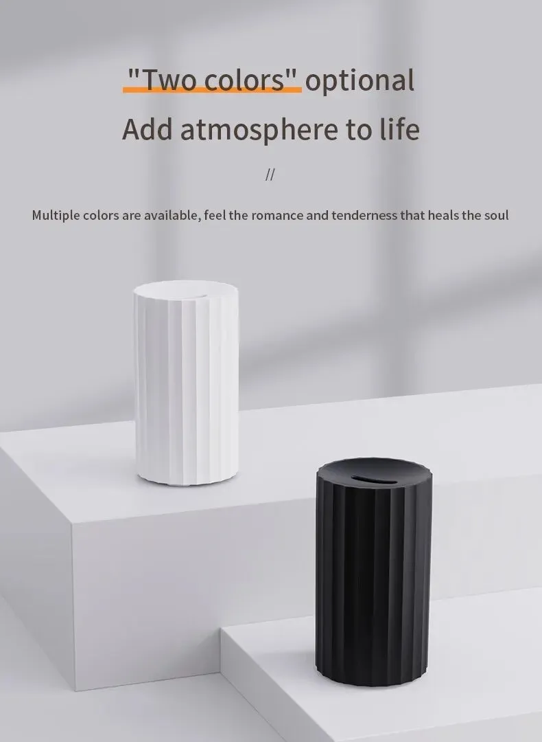 Black and white air humidifier with flame effect lighting and essential oil diffuser function