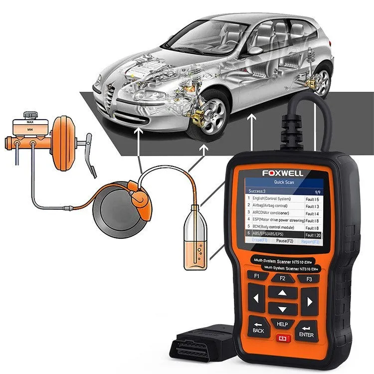 Foxwell NT510 orange and black automotive diagnostic scanner with data cable on a workshop bench.