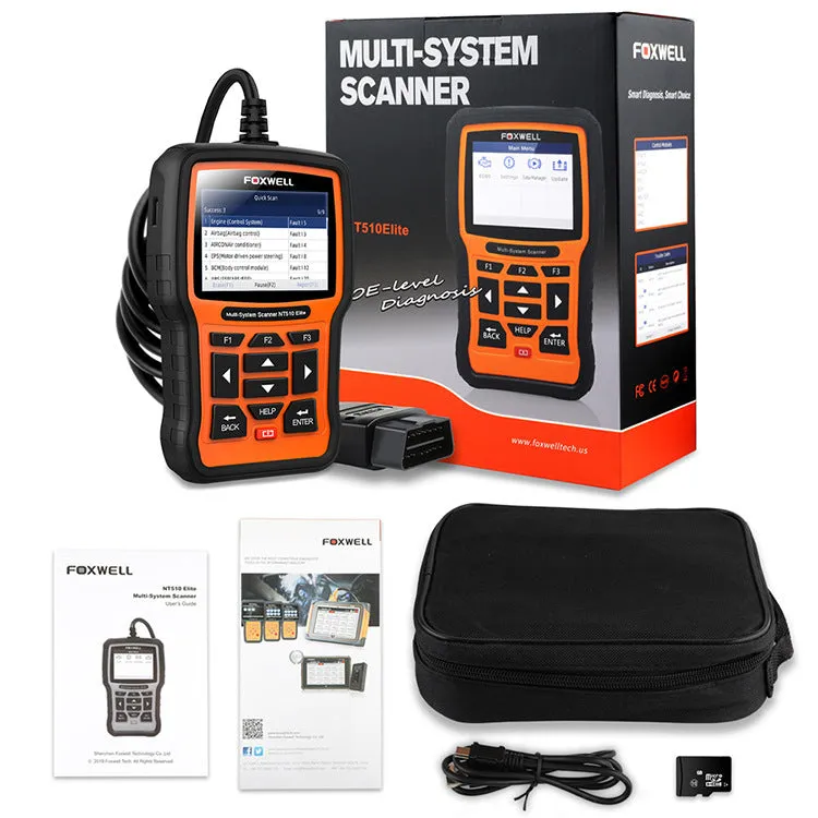 Foxwell NT510 orange and black automotive diagnostic scanner with data cable on a workshop bench.