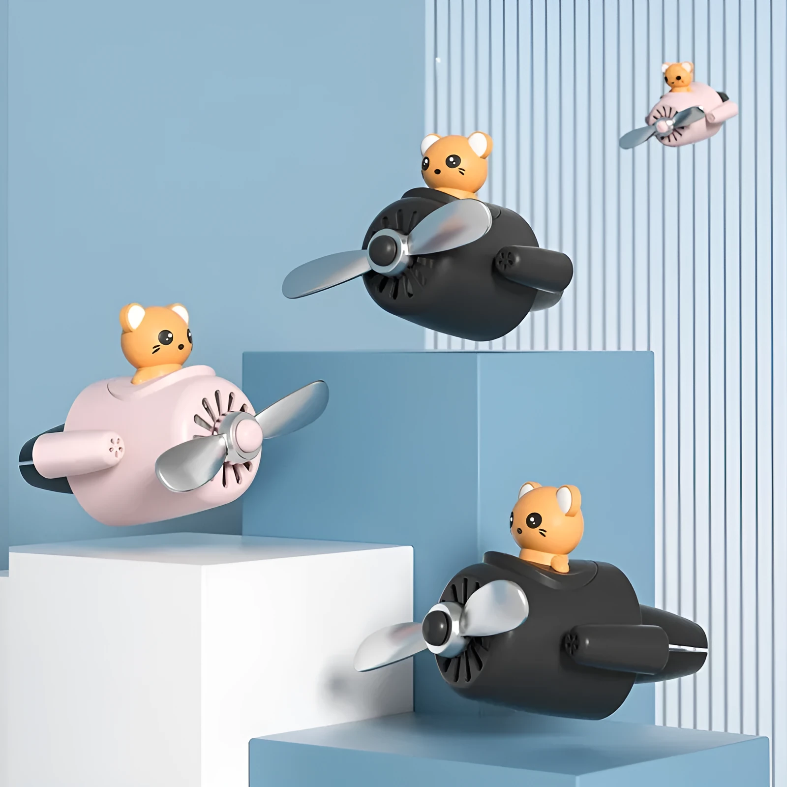 Cartoon aeroplane-shaped plastic clip for car air vent, includes fragrance slices, in black, blue, orange, or pink.