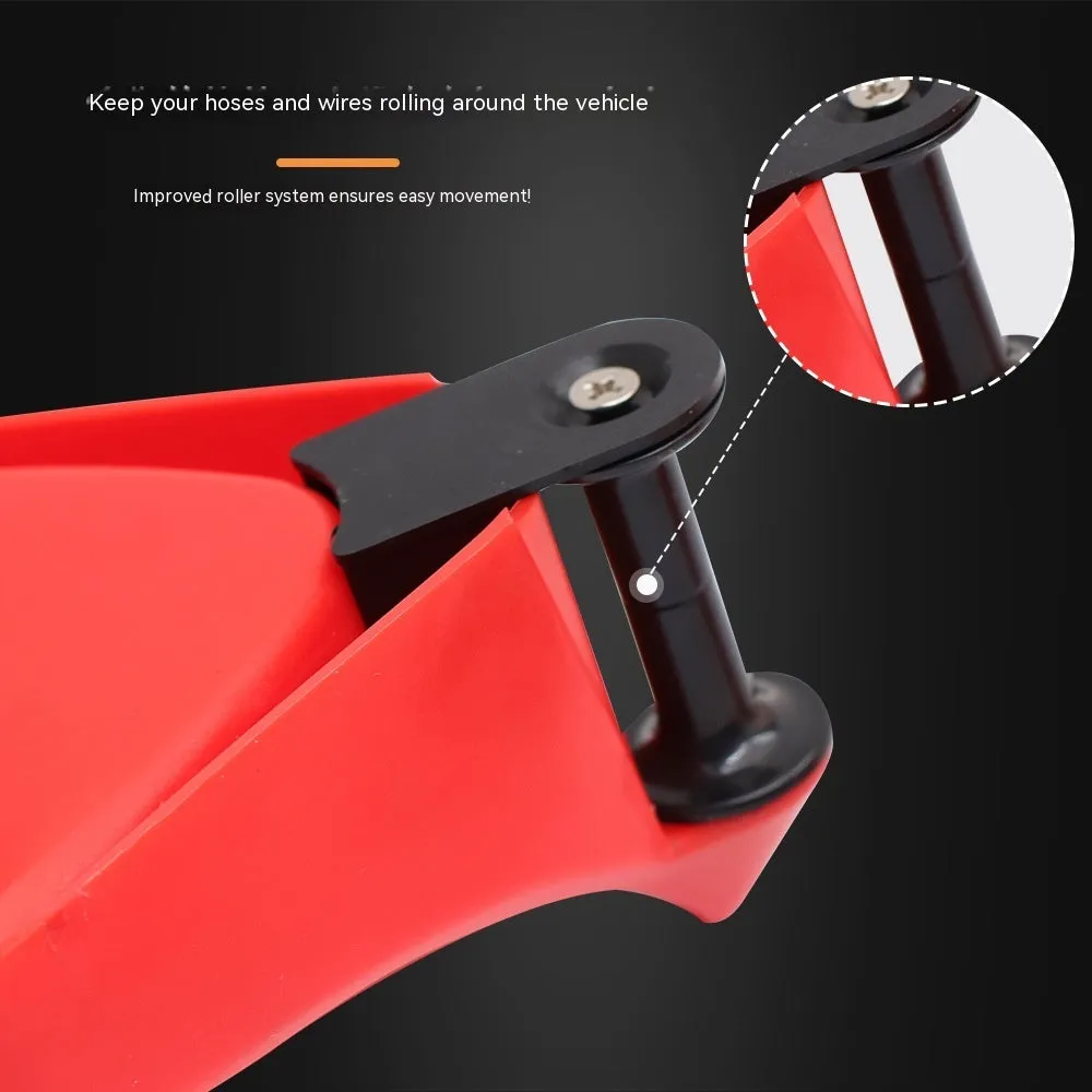 Set of four bright red, wedge-shaped rubber parking blocks for car tyres.