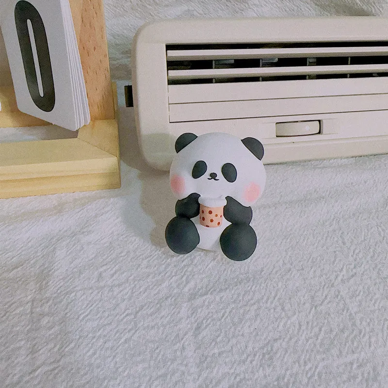 Cute panda-shaped car vent clip air freshener in three character designs: back, holding flower, and milk tea panda.