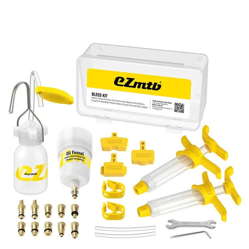 EZmtb bicycle hydraulic brake bleed kit with syringes, bottles, hoses, and metal adapters on a workbench.