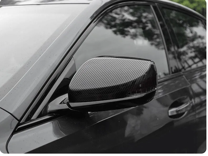 Set of ABS plastic mirror covers for Cadillac CT5 CT6 in carbon fibre, silver, and rain frame styles.