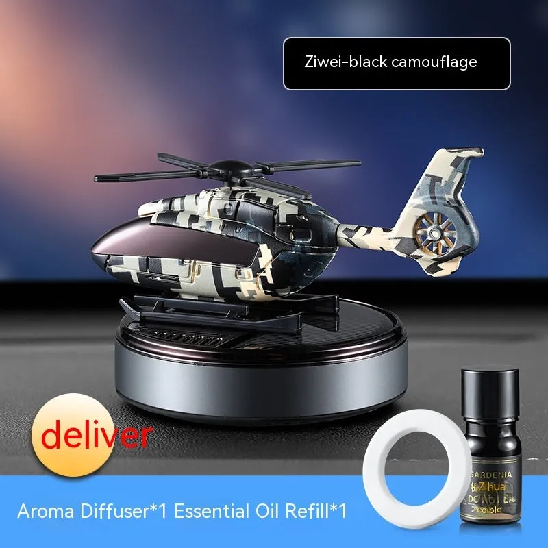 Solar-powered camouflage design car perfume and decoration unit on a car dashboard.