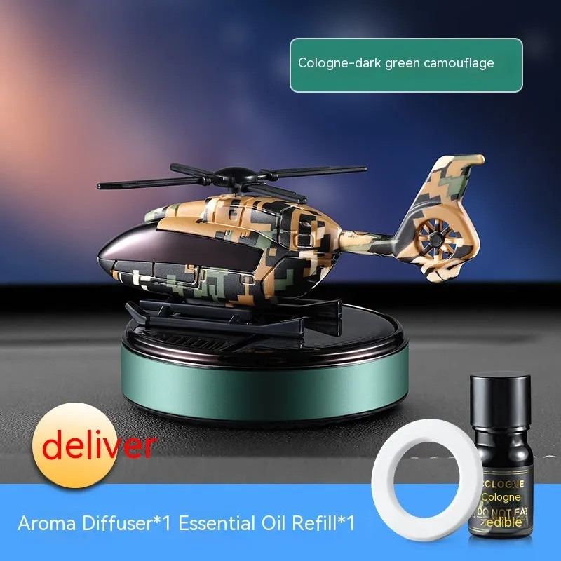 Solar-powered camouflage design car perfume and decoration unit on a car dashboard.