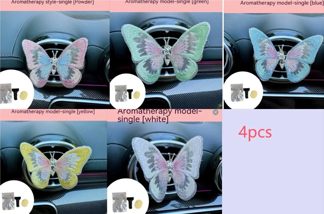Soft fabric embroidered butterfly car air vent decoration in multiple colour options on a centre console.