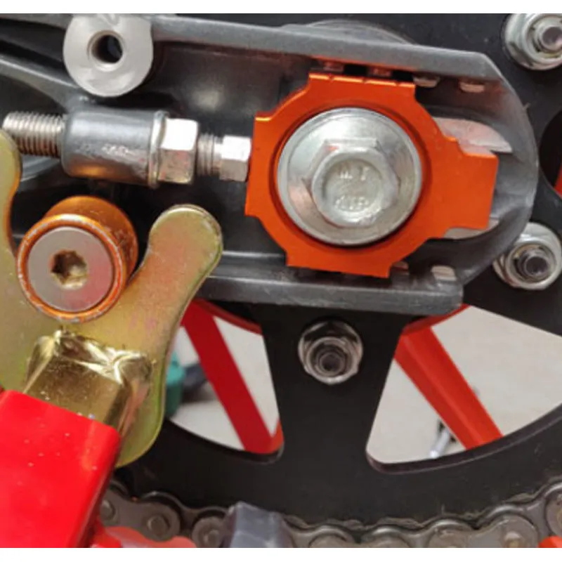 Orange motorcycle regulator screws for KTM DUKE rear fork modification