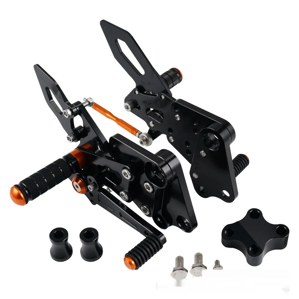 KTM Duke foot pedal bracket assembly for raised rear shift pedal in black or orange