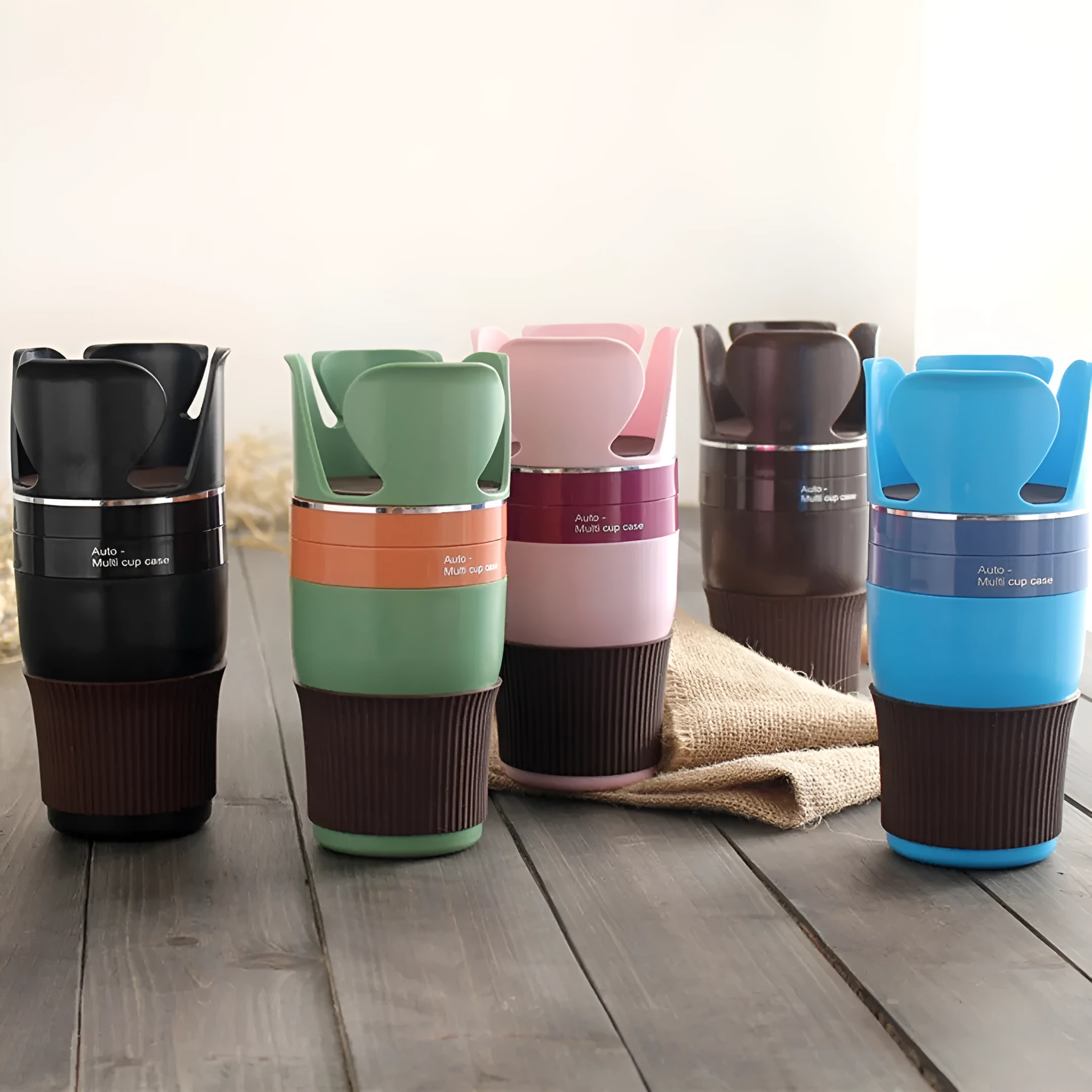 Car multifunctional cup holder and navigation mount organiser in black, brown, pink, green, or blue colours.