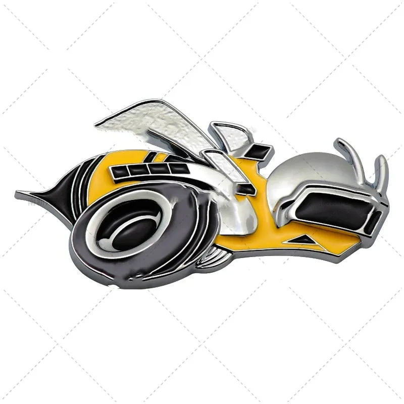 Pair of large yellow and silver Big Bee zinc alloy bumper stickers on a car bumper.