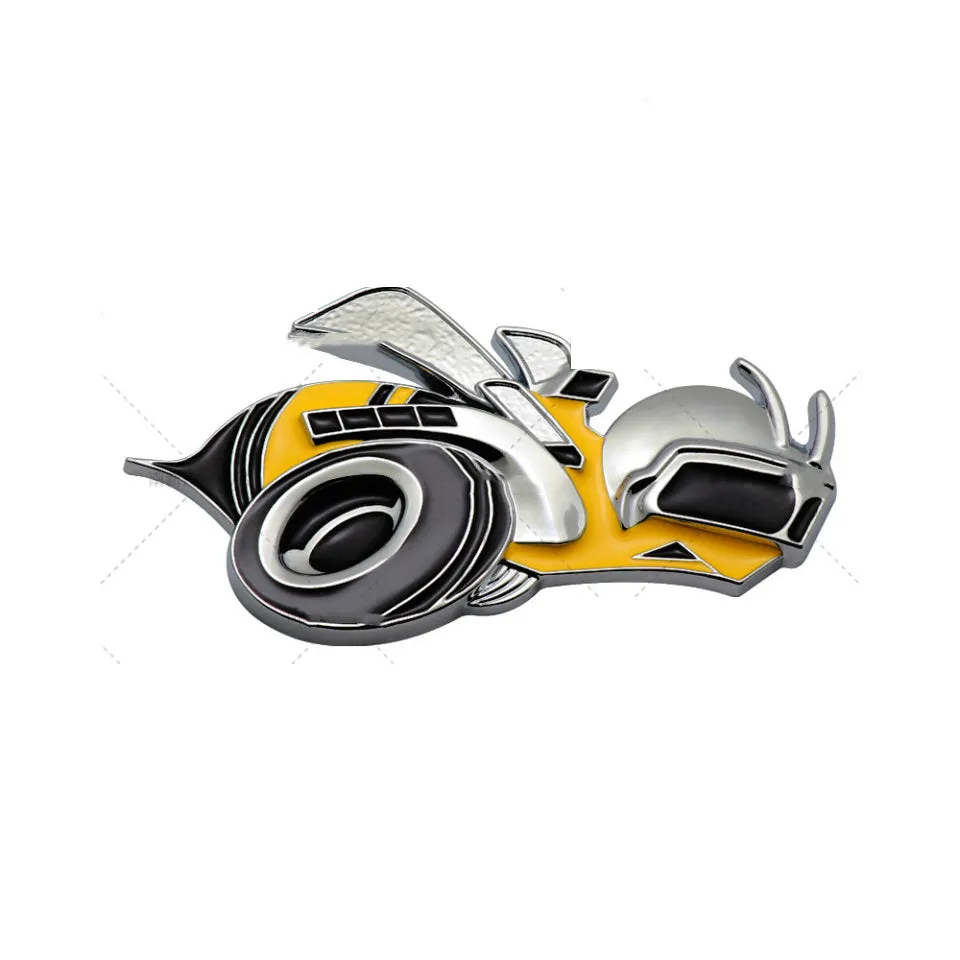 Pair of large yellow and silver Big Bee zinc alloy bumper stickers on a car bumper.