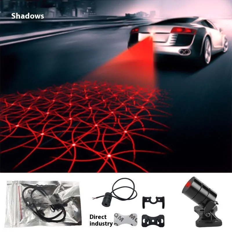 Motorcycle laser fog light unit with aluminium housing projecting star pattern on road surface.