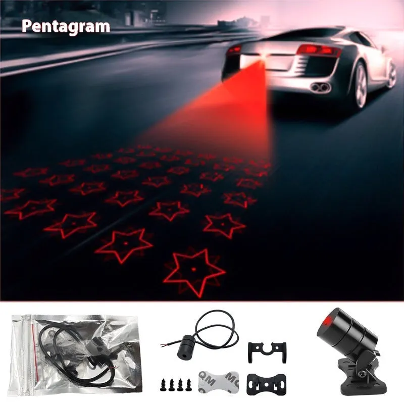 Motorcycle laser fog light unit with aluminium housing projecting star pattern on road surface.