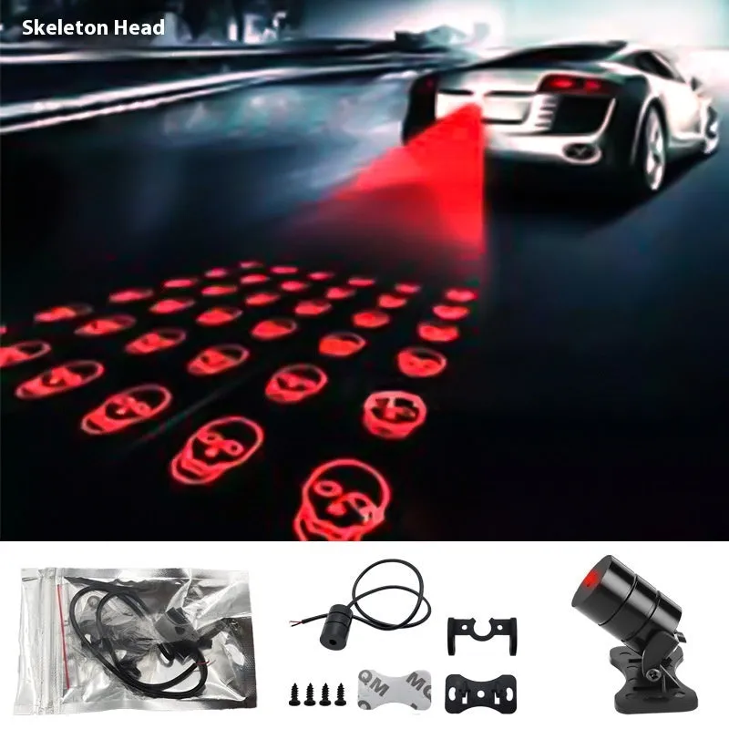 Motorcycle laser fog light unit with aluminium housing projecting star pattern on road surface.