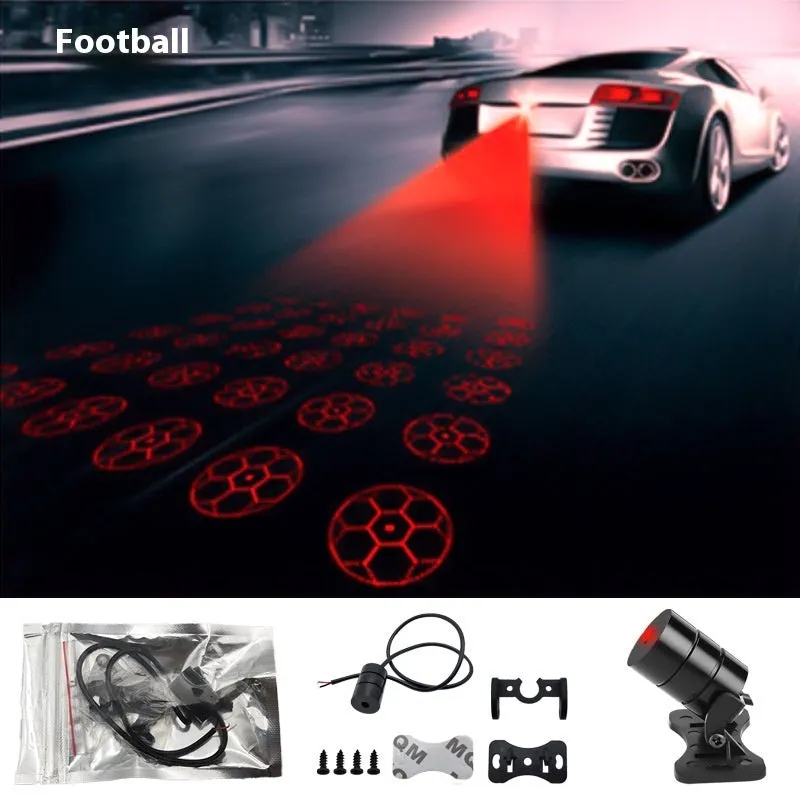 Motorcycle laser fog light unit with aluminium housing projecting star pattern on road surface.