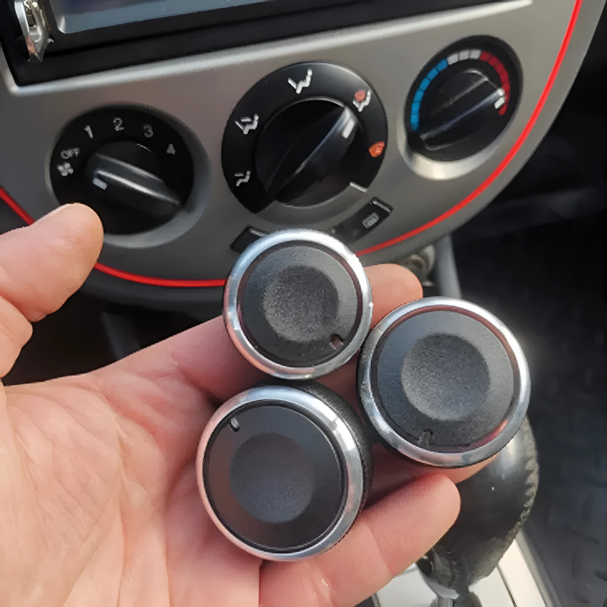 Three black aluminium alloy air conditioning rotary knobs for Chevrolet Lefeng and Lechi dashboard