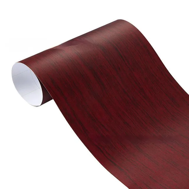 Roll of matte wood grain PVC vinyl wrap film for car colour change and customisation.