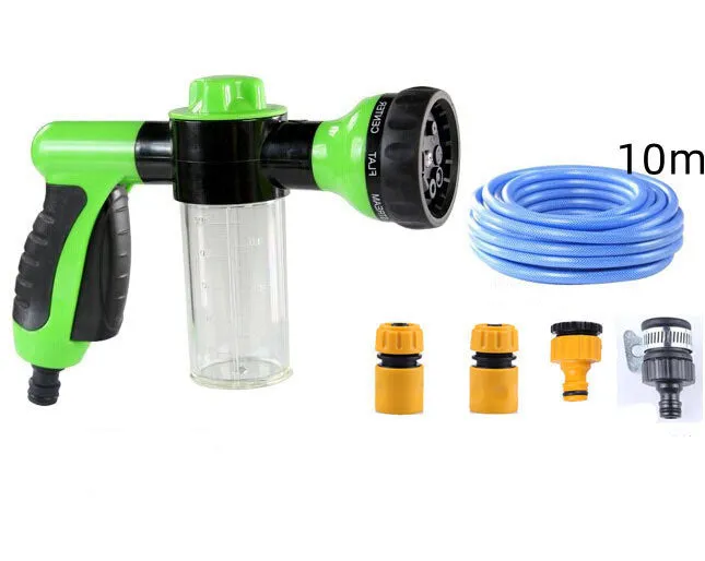 Green high-pressure foam spray gun for car washing with adjustable nozzle and attached water pipe.