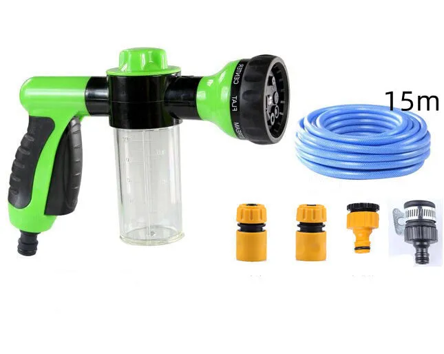 Green high-pressure foam spray gun for car washing with adjustable nozzle and attached water pipe.