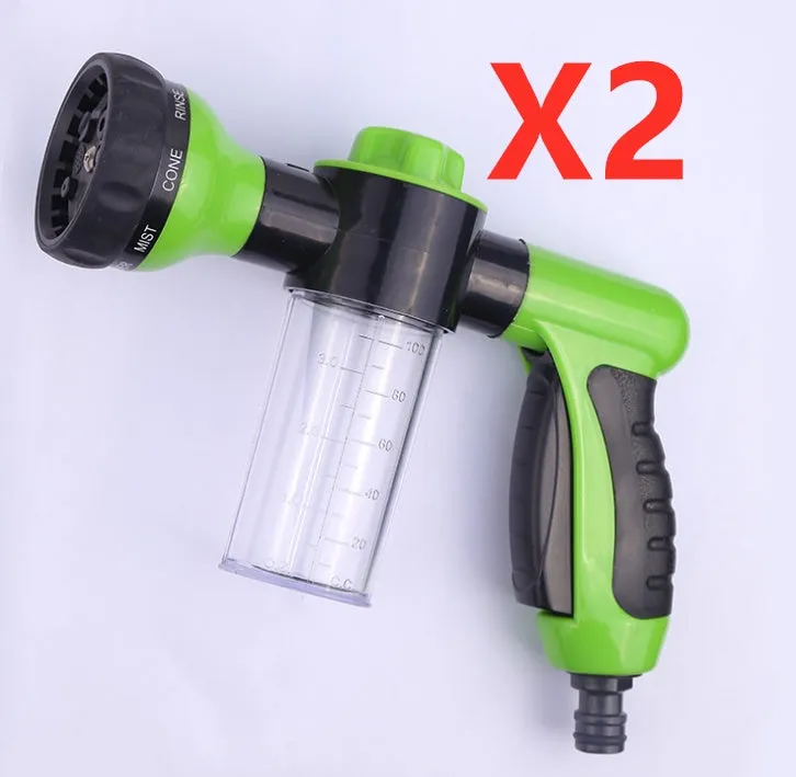Green high-pressure foam spray gun for car washing with adjustable nozzle and attached water pipe.