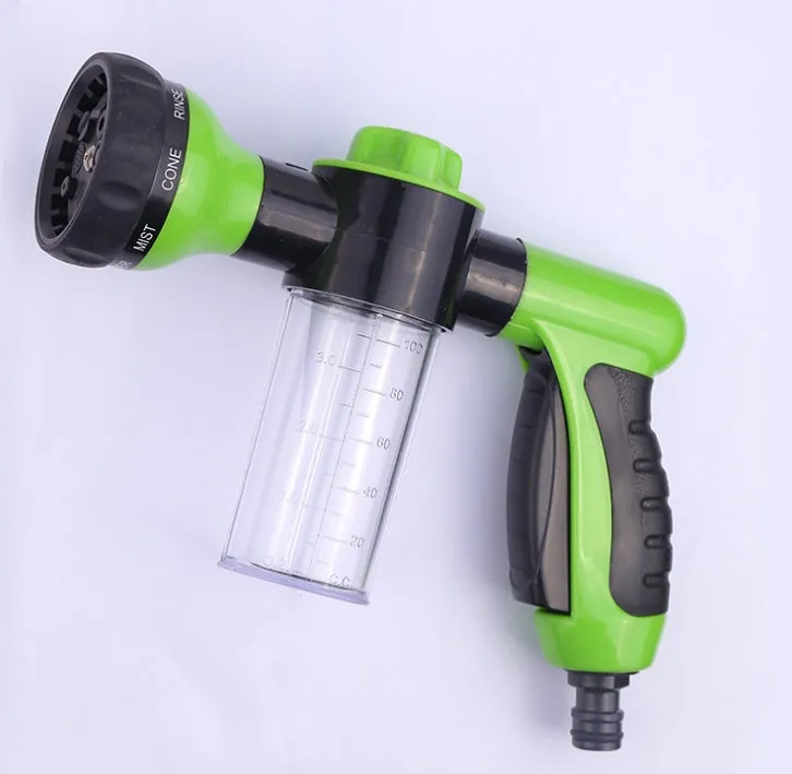 Green high-pressure foam spray gun for car washing with adjustable nozzle and attached water pipe.