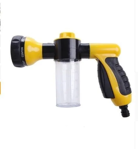 Green high-pressure foam spray gun for car washing with adjustable nozzle and attached water pipe.