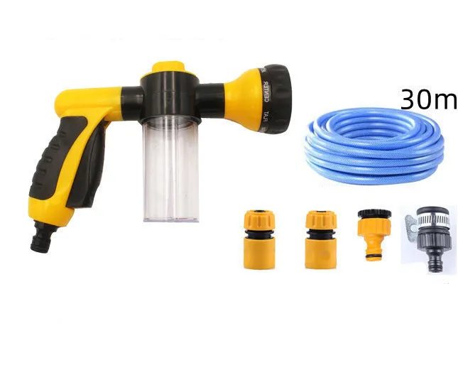 Green high-pressure foam spray gun for car washing with adjustable nozzle and attached water pipe.