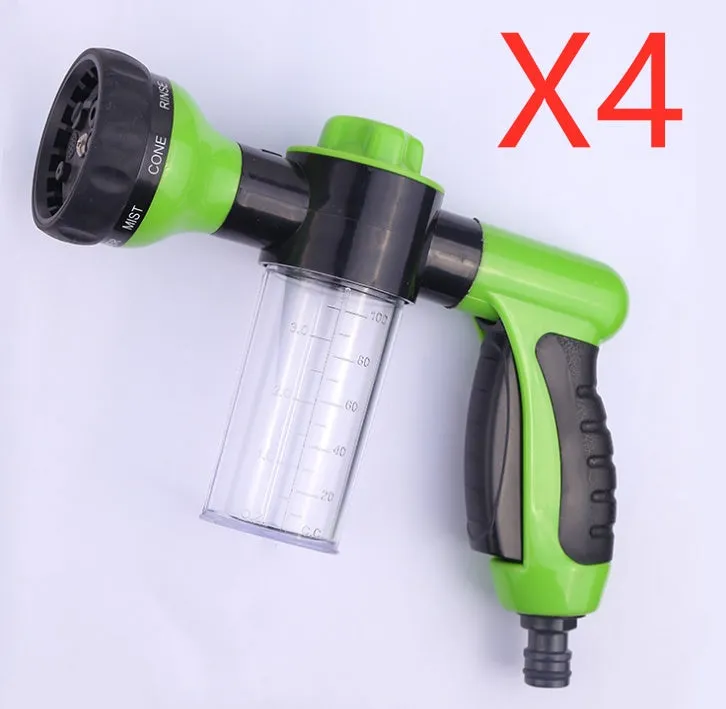 Green high-pressure foam spray gun for car washing with adjustable nozzle and attached water pipe.