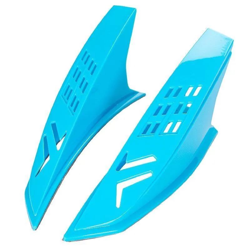 Pair of coloured decorative horn accessories for a child's motorcycle helmet.