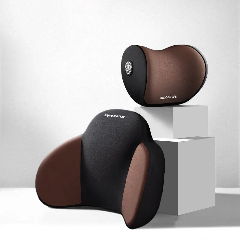 Black memory foam triangle lumbar support pillow and headrest on a car seat.